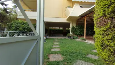 an external view of a house with a yard at Garden Apartment with BBQ in the Athenian Riviera in Athens