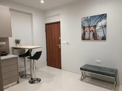 a room with a desk and a table and a door at Embassy Apartment - I2 in Athens