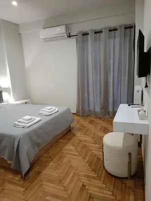 a bedroom with a bed with two towels on it at Embassy Apartment - I2 in Athens