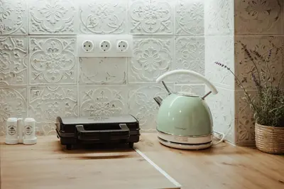 a tea kettle and a toaster on a kitchen counter at Aria apartment in Athens
