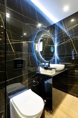 a bathroom with a toilet and a sink and a mirror at The Charm Studio in Glyfada in Athens