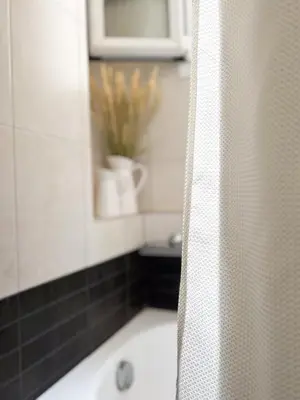 a bathroom with a shower with a bath tub at My Porto Villa in Porto Rafti