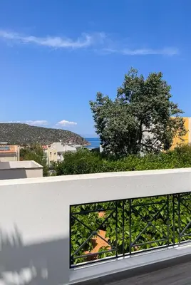 a balcony with a view of the ocean at My Porto Villa in Porto Rafti