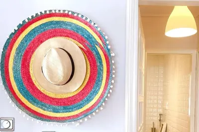 a rainbow wreath hanging on a wall in a room at Superior Penthouse in Athens Riviera in Athens