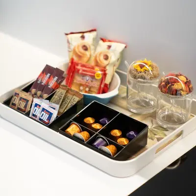 a white tray with pastries and other items on a table at Athens Sea Front Apartment, Varkiza in Varkiza