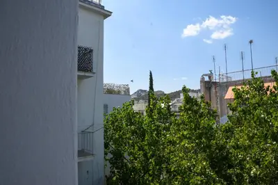 a view of a city with trees and buildings at Velvet new apt in Ilissia in Athens