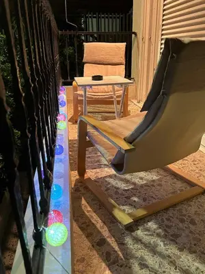 a porch with a slide and a chair and a table at Love Travel Athens Apartments in Athens