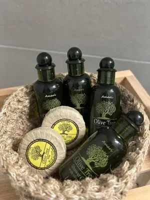 a basket with four bottles of wine in it at Love Travel Athens Apartments in Athens