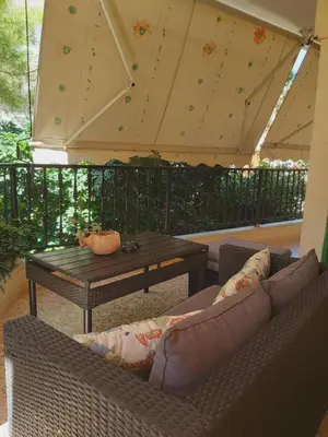a patio with two couches and a table and a tent at Love Travel Athens Apartments in Athens