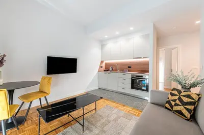 a living room with a couch and a table at Phaedrus Living: Luxury Flat Panormou in Athens