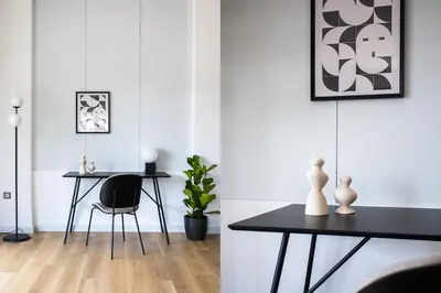 a dining room with a table and a chair at Breezy 2BR Apartment by Marina Flisvos by UPSTREET in Athens