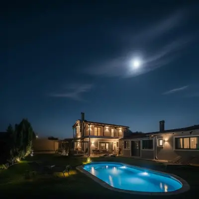 a house with a swimming pool at night at Casa Del G in Metókhi
