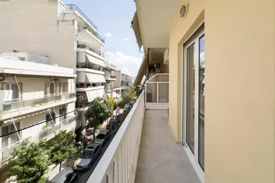 a balcony of a building with plants at New Spacious & Stylist Apt in Piraeus