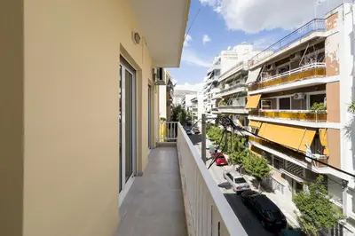an apartment balcony with a view of a street at New Spacious & Stylist Apt in Piraeus