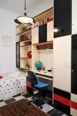 a bedroom with a desk and a chair in a room at Spacious central apartment wh free parking spaces in Athens