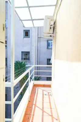 an empty balcony of a building with a window at Spacious central apartment wh free parking spaces in Athens
