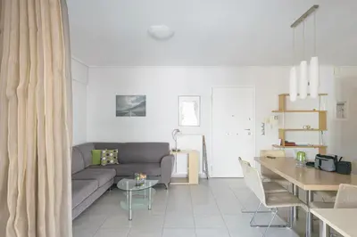 a living room with a couch and a table at Family Sunny 2 bedroom near center 50m busstop,300m busstop Acropolis in Athens
