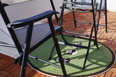 a group of chairs with soccer balls on the floor at Dafni City Apartment 5 in Athens