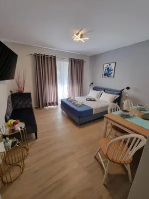 a bedroom with a bed and a table and a couch at Harmony in everything in Athens