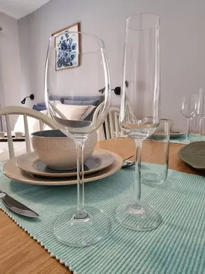two empty wine glasses sitting on a table at Harmony in everything in Athens