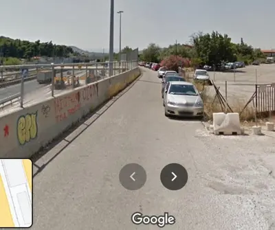 a car parked on the side of a road at Metro Paĺlini Rooms to Rent 20 min to Syntagma 15 minutes to Airport 24 hours train Bus and 200 meter aŵay in Pallíni