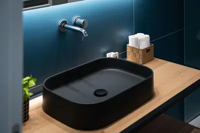a black sink on a counter in a bathroom at Glyfada Unique Residence in Athens
