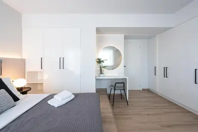 a bedroom with a bed and a desk at Luxury 4 Bedrooms Apartment Near Flisvos Marina in Piraeus