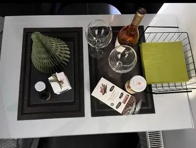 a white table topped with a white table with wine glasses at Only2Suites in Athens
