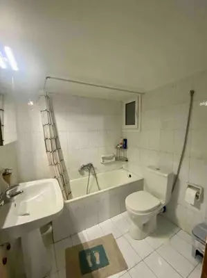 a bathroom with a toilet and a tub and a sink at Lovely flat Korydallos in Piraeus