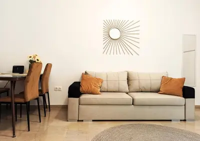 a living room with a couch and a table at Kremou Studio in Athens