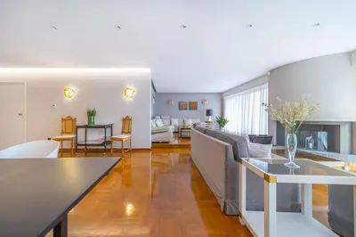 a living room with a couch and a table at The HostMaster Luminous Elite Estate in Athens