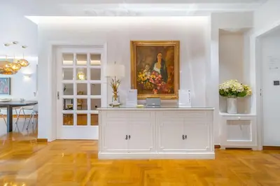 a white room with a painting on the wall at The HostMaster Luminous Elite Estate in Athens