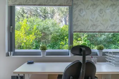 a window in a kitchen with a table and a chair at The HostMaster Luminous Elite Estate in Athens