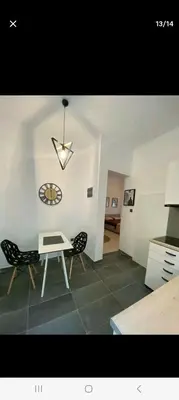 a living room with a table and two chairs at ANAFIS STUDIO in Athens