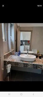 a bathroom with a large sink on a counter at ANAFIS STUDIO in Athens