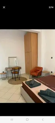 a living room with a couch and a table at ANAFIS STUDIO in Athens