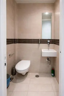 a bathroom with a toilet and a sink at Modern flat close to the beach-ground floor in Athens