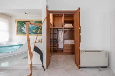 a bathroom with a bath tub and a sink at Varkiza Riviera in Varkiza