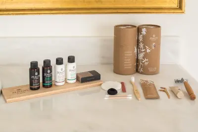 a shelf with five products sitting on a wall at Varkiza Riviera in Varkiza