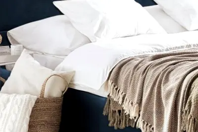 a white bed with white pillows and a blanket at LP appartment athens in Psikhikón