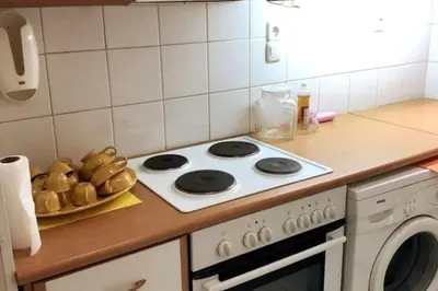 a kitchen counter with a stove and a plate of bread at LP appartment athens in Psikhikón