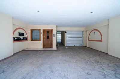 an empty room with a garage with a door at Duplex Penthouse with Sauna & Acropolis View in Athens