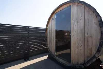 a wooden barrel with a window on a building at Duplex Penthouse with Sauna & Acropolis View in Athens