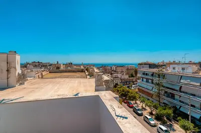 a view of a city from the roof of a building at Top-Floor Studio in Glyfada Center with Sea View in Athens