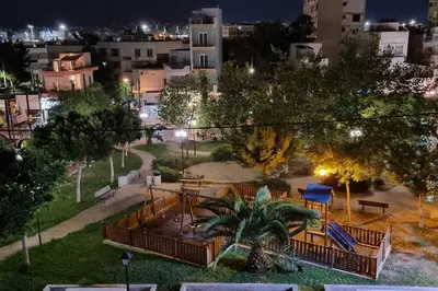 a view of a park at night at Park View - PS4 in Piraeus