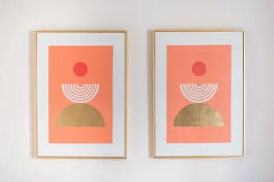 two framed illustrations of a person and a rock at Comfortable Apartment In Athens in Athens
