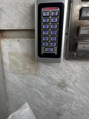 a close up of an atm machine with a cell phone at Sea view apartment steps away from the Beach Anavyssos Palaia Fokaia in Áyios Yeóryios