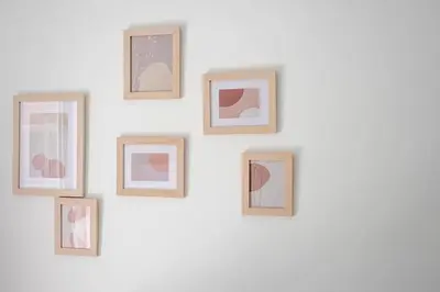 a group of framed pictures on a wall at Private Voula Beach Suite in Athens