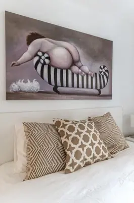 a painting of a woman sitting on a hot tub at Hidden Gem: 2BR Artistic Retreat in Glyfada Center in Athens