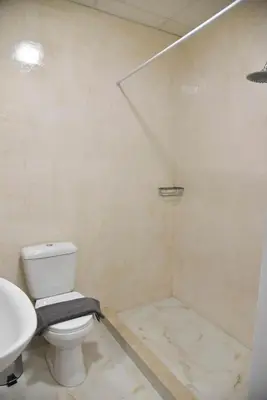 a bathroom with a toilet and a sink at Athens Zeus A by Super Host Hub in Athens